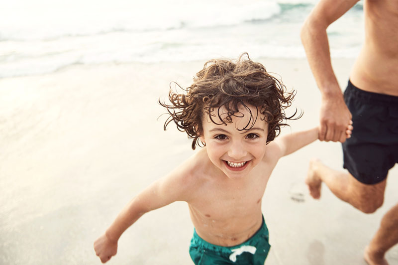 Boy running on beach